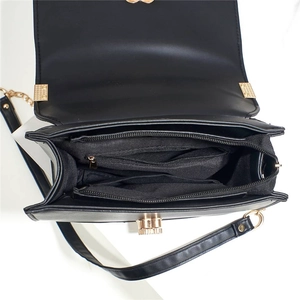 Black crocodile embossed crossbody bag with multi-compartment interior and gold hardware