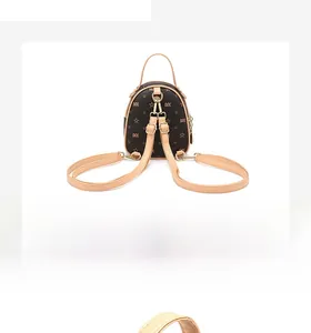 Detail of mini backpack with star pattern, brown leather straps and gold hardware
