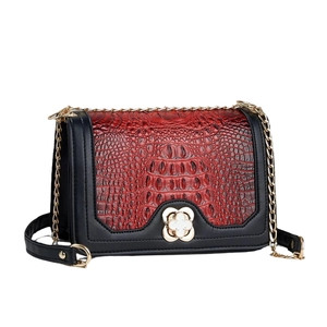 Chic burgundy crocodile texture flap bag with gold chain and clover clasp detail