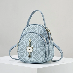 Mini light blue backpack for women with circular patterns and cute cat pendant charm