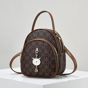 Vintage brown monogram mini backpack with dual zippers and cute cat pendant charm
