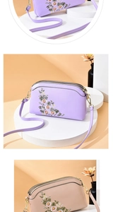Close-up of floral embroidery on shell-shaped PU leather crossbody bag with dual zippers