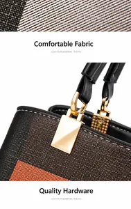 Detail der Karo-Handtasche mit strukturiertem Stoff, orangefarbenem Rand und Goldbeschlägen