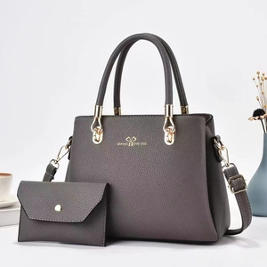 Grey faux leather tote set for women including matching envelope wallet and crossbody strap