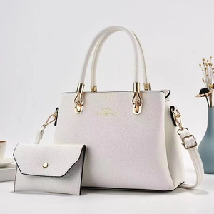 White litchi pattern handbag set with crossbody bag and wallet in a stylish setting