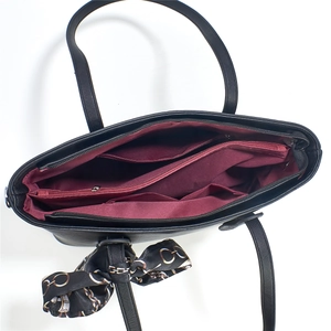 Large black Saffiano leather tote bag with multi-compartment interior and silk scarf