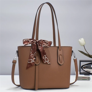 Minimalist dark brown Saffiano tote bag with silk scarf decoration and shoulder strap