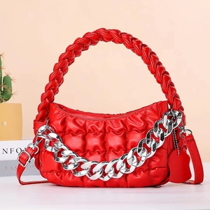 Quilted red handbag with woven handle and chunky silver chain crossbody strap
