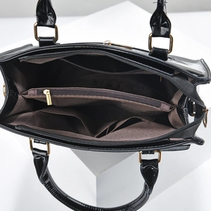 Glossy black patent leather tote bag with three compartments and gold hardware detail
