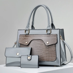 Three-piece grey patent leather handbag set featuring embossed crocodile texture details