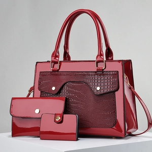 Three-piece red patent leather handbag set featuring embossed crocodile texture panels