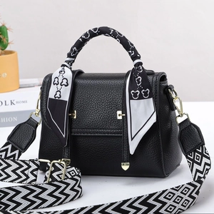 Minimalist black lychee leather handbag with floral silk scarf handle and wide strap