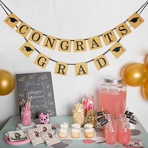 Golden Congrats Grad banner with doctoral caps for graduation party backdrop decorations
