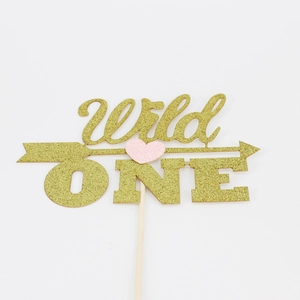 Golden glitter Wild One cake topper with pink heart and arrow for first birthday party
