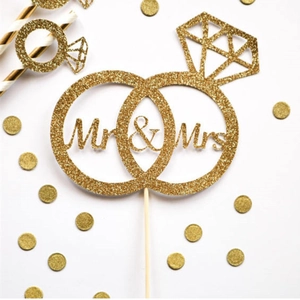 Glittering gold Mr & Mrs cake topper with interlocking rings for wedding party decor
