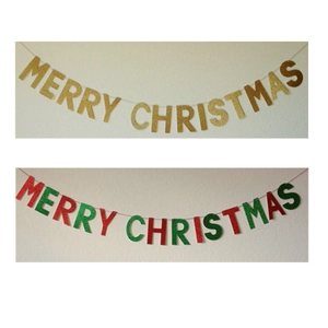 Detail of glittery Merry Christmas banners in gold and red-green festive colors