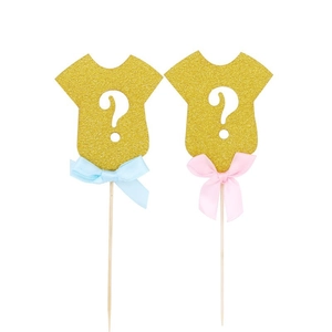 Glittery gold baby bodysuit cake toppers with pink and blue bows for gender reveal parties