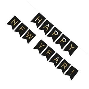 Gold foil Happy New Year banner with black swallowtail flags for festive party decor