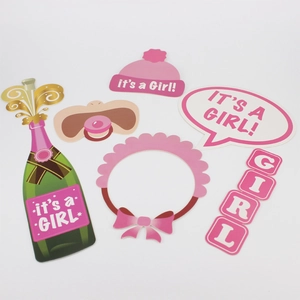 Pink It's a Girl baby shower photo booth props set with bottles and hats on white background