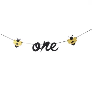 Bumblebee theme 1st birthday banner featuring black cursive one text and bee accents