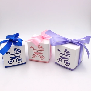Hollow baby stroller candy boxes in blue, pink, and purple with ribbon bows