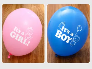Close-up of pink and blue latex balloons with It's a Boy and Girl prints for baby shower