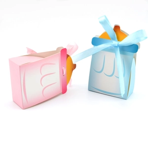 Boîtes à bonbons biberon roses et bleues avec rubans pour fêtes de naissance