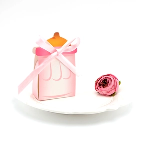Boîte à bonbons en forme de biberon rose avec ruban pour fête de naissance