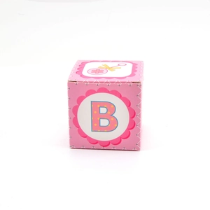 Pink square baby shower favor box featuring a letter B and floral design on white background