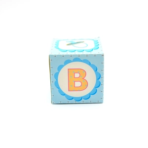 Blue square baby shower gift box featuring a bold letter B and pacifier illustration