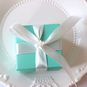 Square Tiffany blue wedding favor candy box with a white satin ribbon and elegant bow