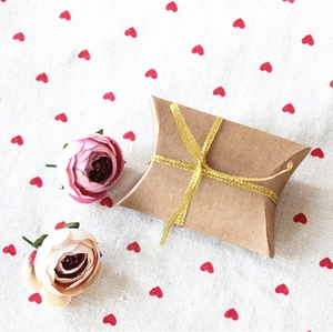Kraft paper pillow gift box with golden glitter ribbon for wedding candy packaging