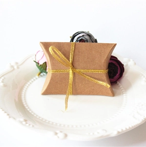 Brown kraft paper pillow favor box with gold ribbon for wedding candy gifts
