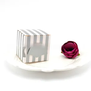 Detail of graduation gift box with vertical stripes and creative paper doctor cap topper