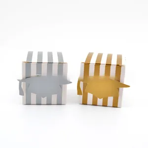 Detail of gold and silver vertical striped graduation gift boxes with doctoral cap motif