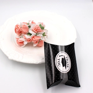 Polka dot pillow box with Thank You sticker and pink paper rose for graduation gifts
