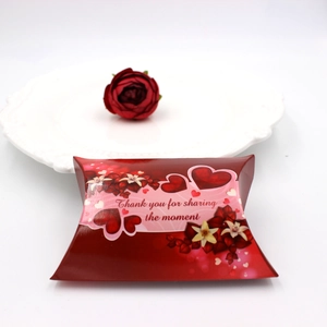 Detail of red pillow gift box with heart floral patterns and Thank You greeting