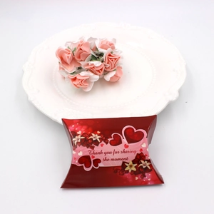 Pillow shape kraft gift box with red heart patterns and pink paper rose for favors
