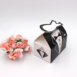 European wedding favor candy boxes with creative tuxedo groom and bride dress designs