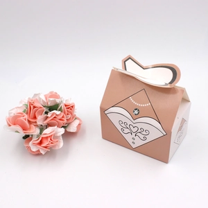European wedding candy box featuring a bridal dress design and heart-shaped handle