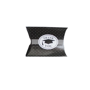 Black polka dot graduation candy box in pillow shape with Thank You label and mortarboard