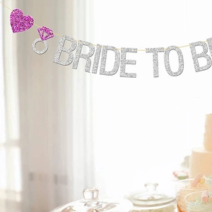 Silver glitter Bride to Be banner with pink heart and ring for wedding party decor