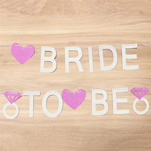 Silver glitter Bride to Be banner with pink hearts and rings for wedding party decor