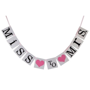 Miss to Mrs wedding banner detail with gray cards and pink heart accents for decoration