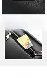 Close-up of black lychee leather texture with functional back zipper pocket and pearl detail