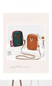 Two mini crossbody leather phone bags in contrast colors on geometric pedestals