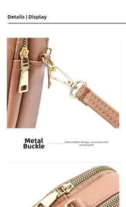 Detail of crossbody bag featuring golden metal hardware and detachable strap