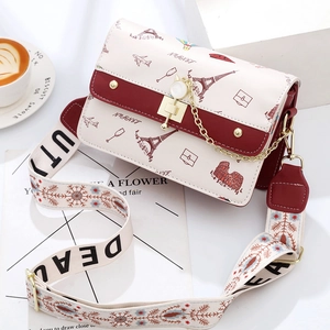 Cartoon travel print crossbody bag with Eiffel Tower motif and cat-shaped metal clasp