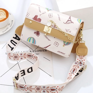 Chic beige square crossbody bag with colorful travel patterns and patterned wide strap