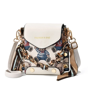 Minimalist beige cartoon bear crossbody phone bag with chain strap and gold lettering